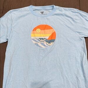 Vuori Sky Blue Tee with Sunset Graphic